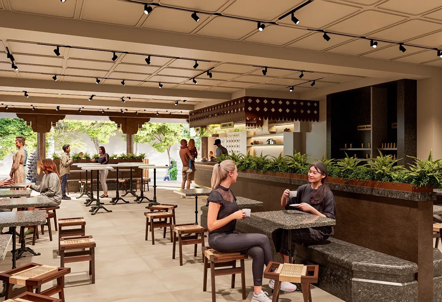 The dining floor: granite tops, low cane stools and ferns along the bench backs